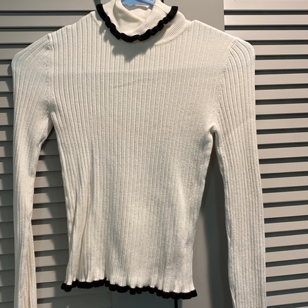 White and black sweater